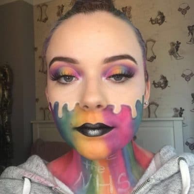 Liliana Smith with rainbow painted face and the words thank you NHS on her neck