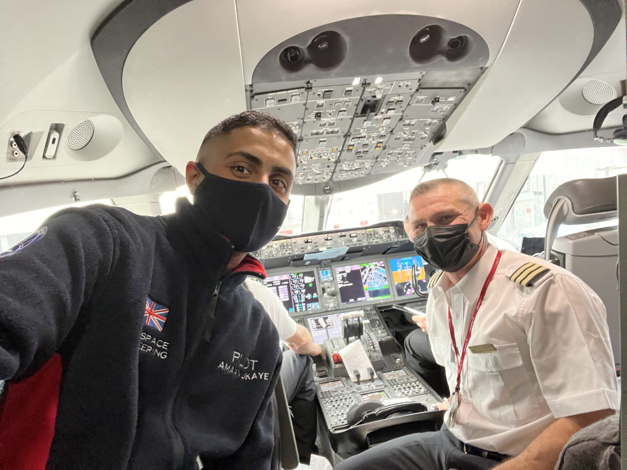 student in flight deck with pilot