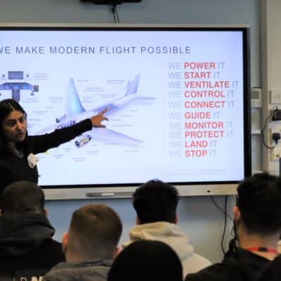 Students in aerospace lecture - pointing at plane on screen