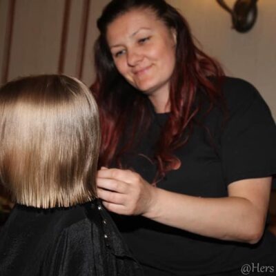 woman styling child's hair