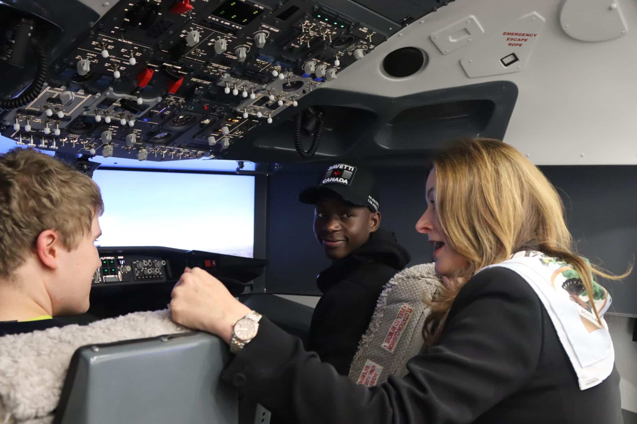 students smile at MP in flight simulator