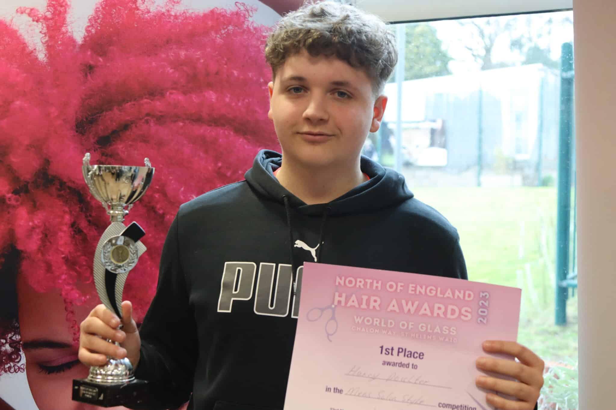Barbering students win big - 1st place held by young man