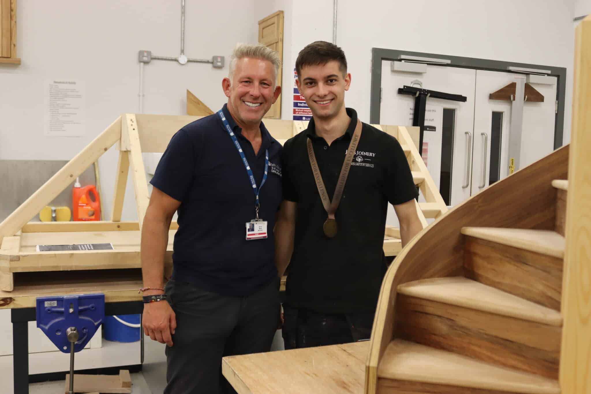 Harry in the woodwork studio at Woodlands Campus with tutor Arron Ward