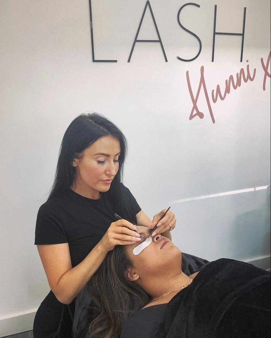 Laura tending to her clients lashes