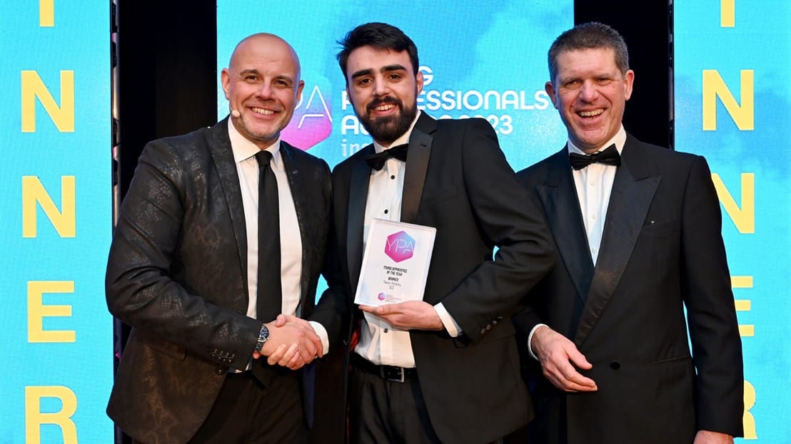 Owain Perkins posing with his award