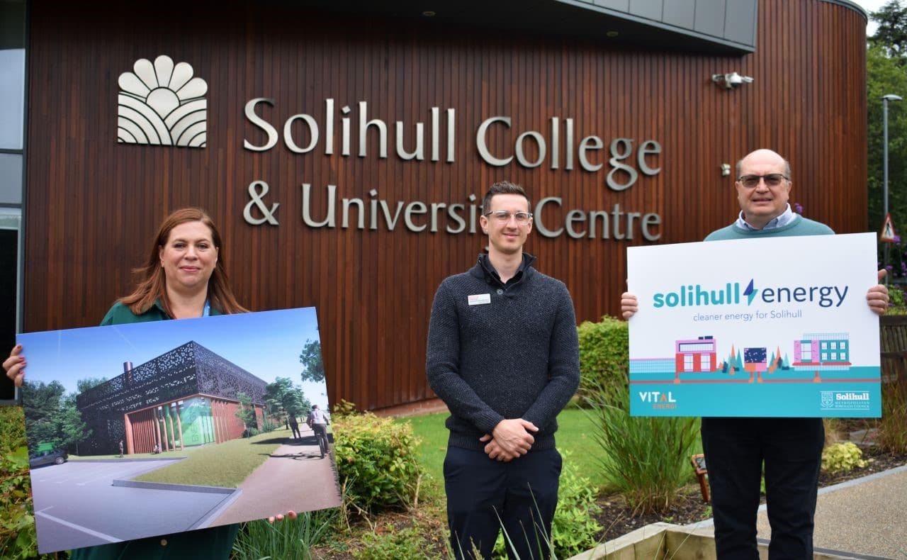 Principal Dr Rebecca Gater holding a sign about Solihull Energy outside the college