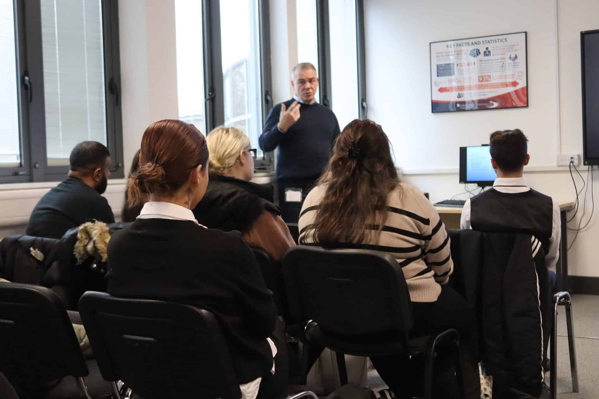 Sir David Thompson chatting to Solihull College students