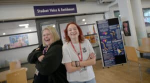 Grace and sasha in front of student enrichment laughing