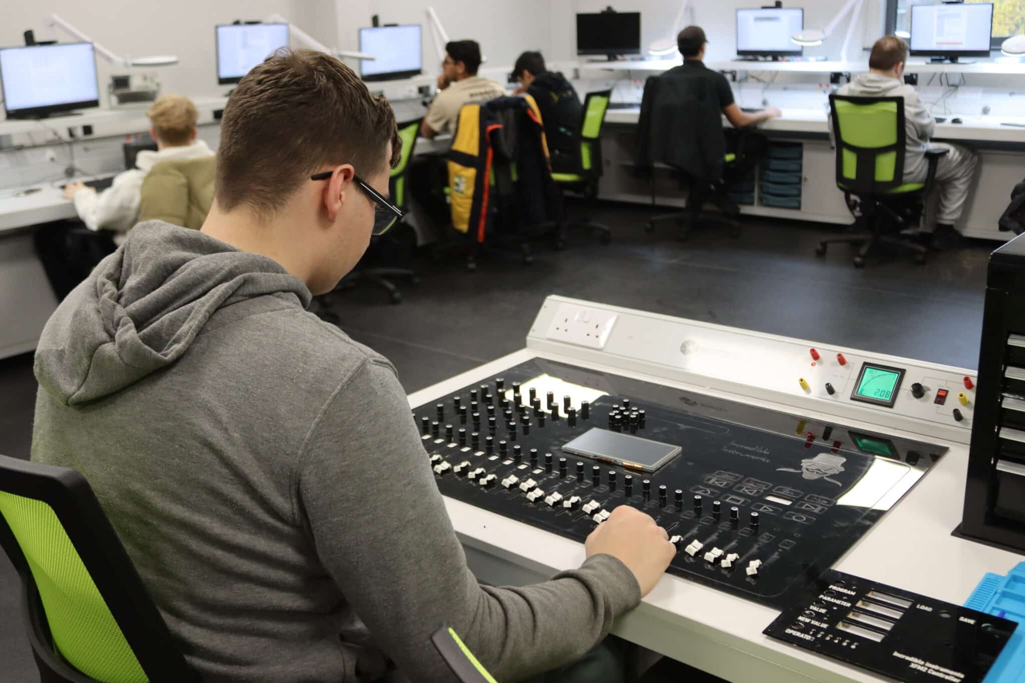 Solihull College student working at a mixing desk