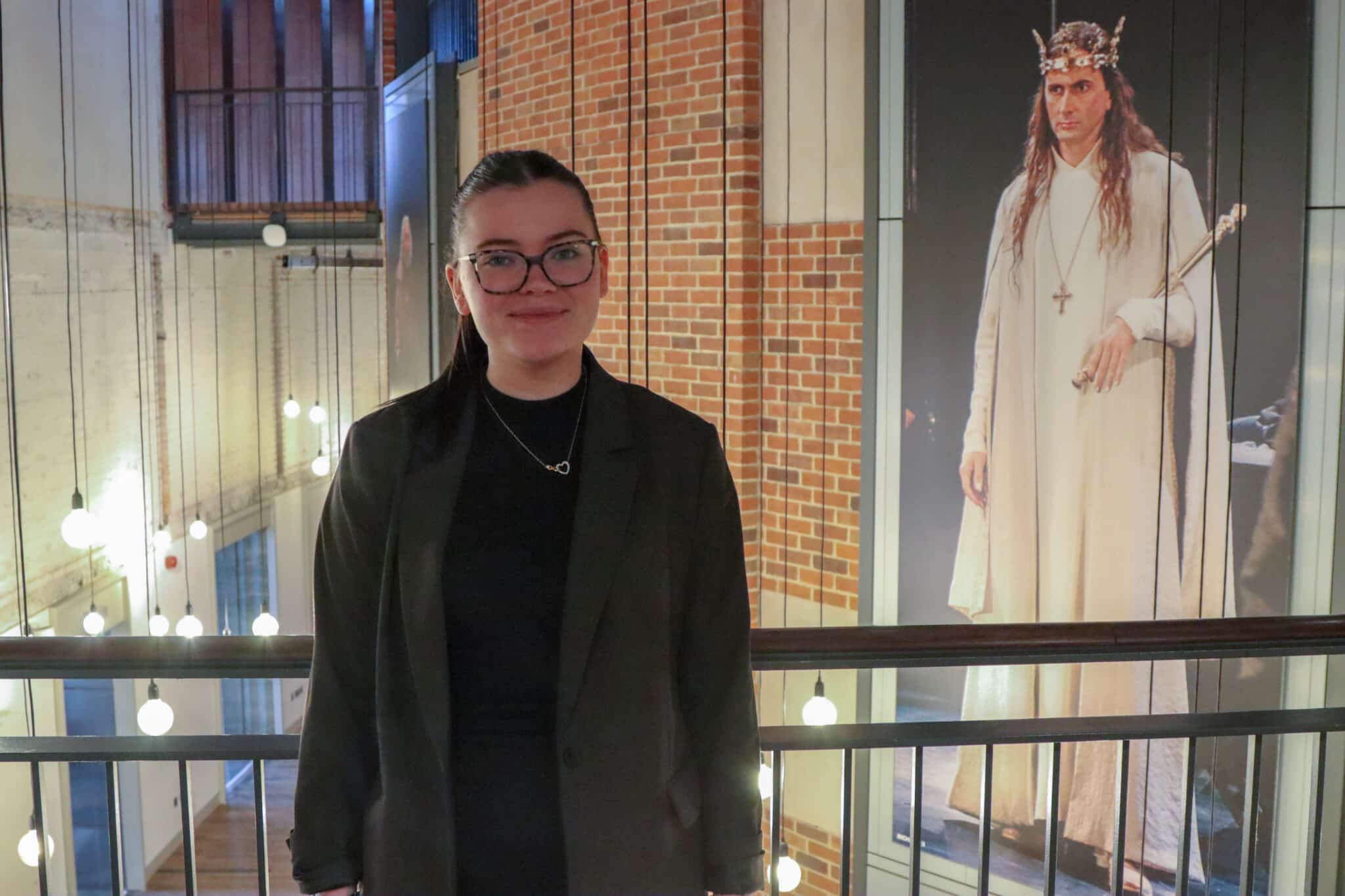 aine brown stood on balcony in RSC