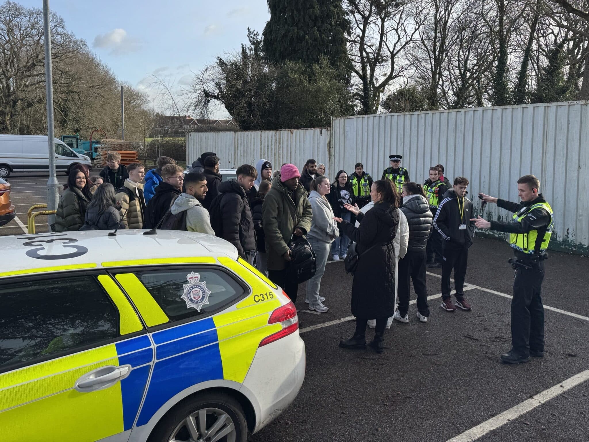 police car with students