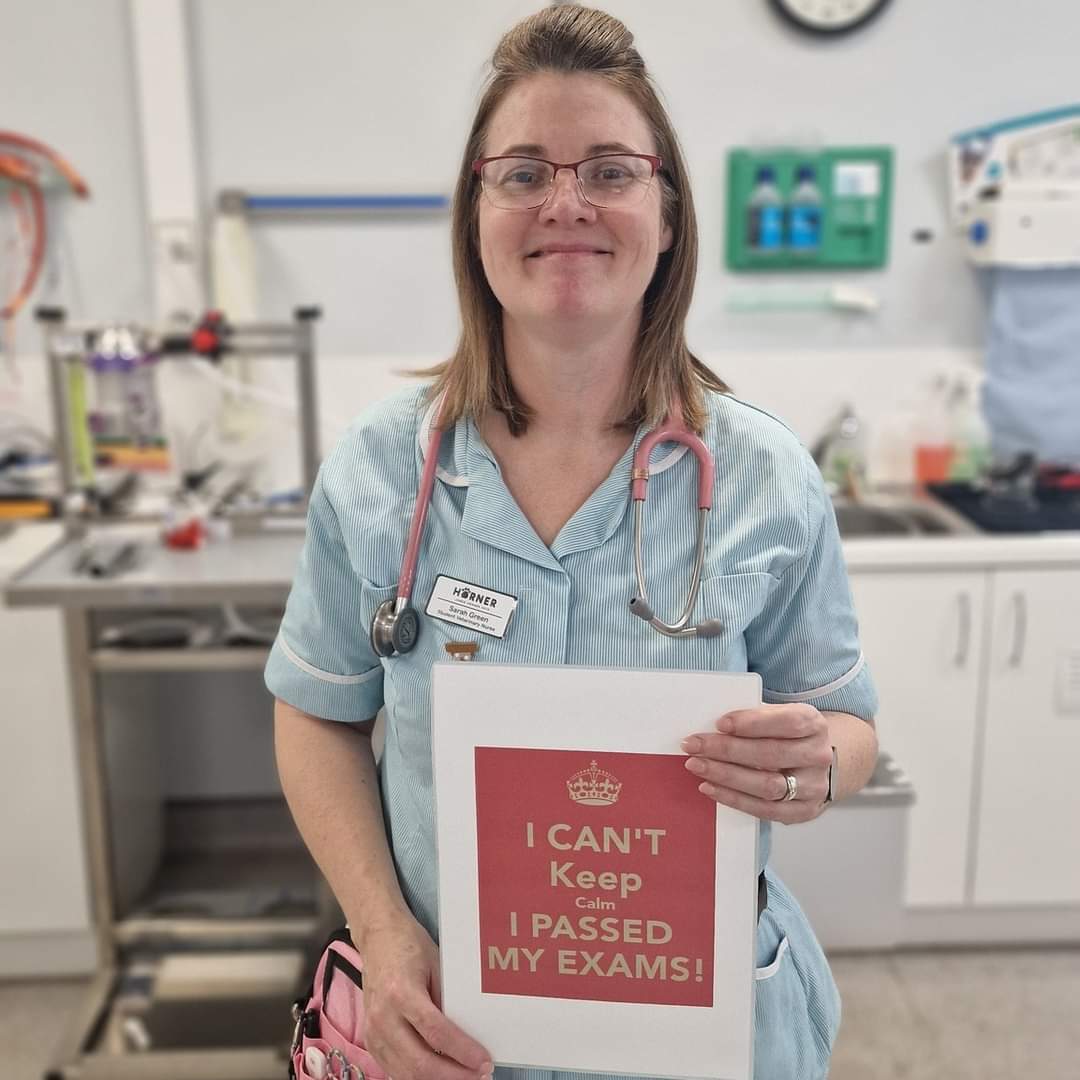 Sarah at vets holding a poster saying Keep Calm I've passed my exams